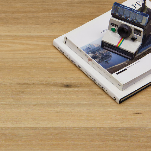Polaroid Camera and Books on Heartridge Australian Timber Flooring